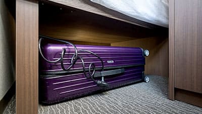 Baggage storage under bed